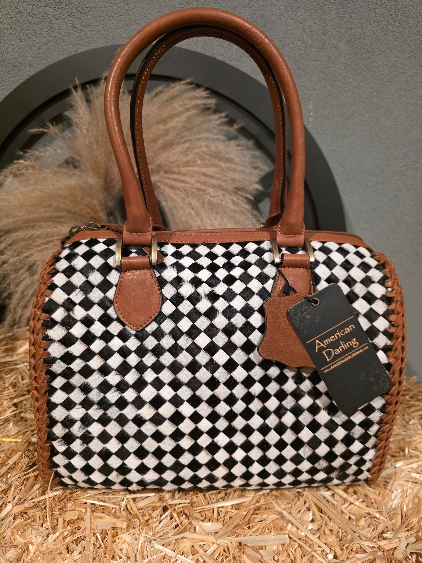 MEDIUM COWHIDE BLACK WHITE AND BROWN DUFFLE