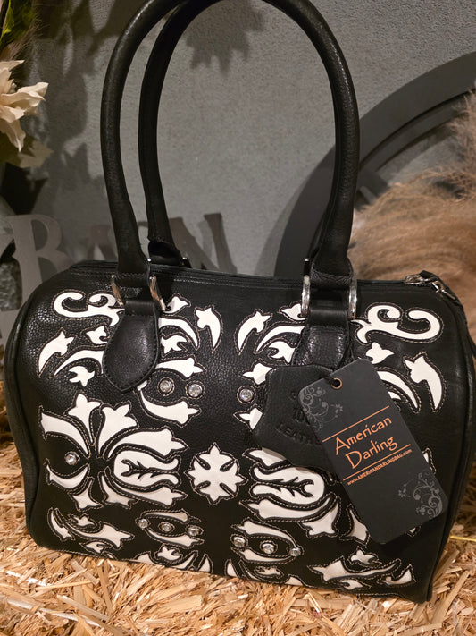 BLACK WITH WHITE UNDERLAY LEATHER DUFFLE