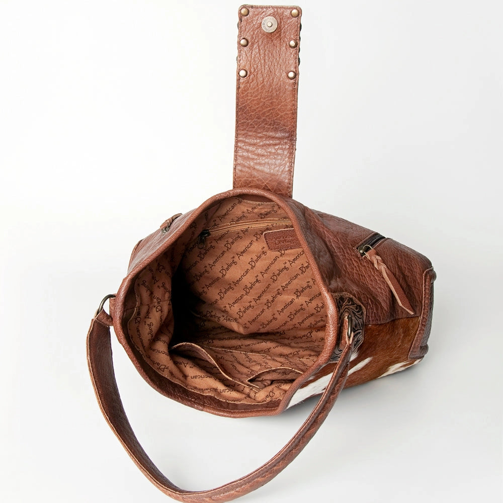 Hair-On Cowhide Hobo Bag with Tooled Leather Strap & Turquoise Concho Accent -